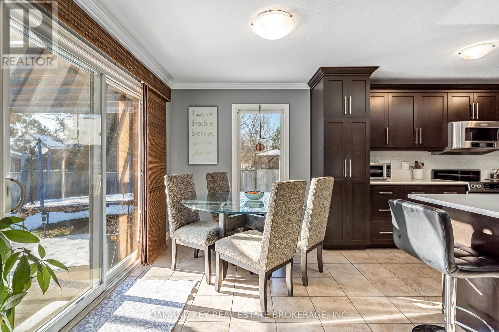 Dining area overlooking the backyard - 34 Fieldstone Crescent, Middlesex Centre (Komoka), ON - Indoor