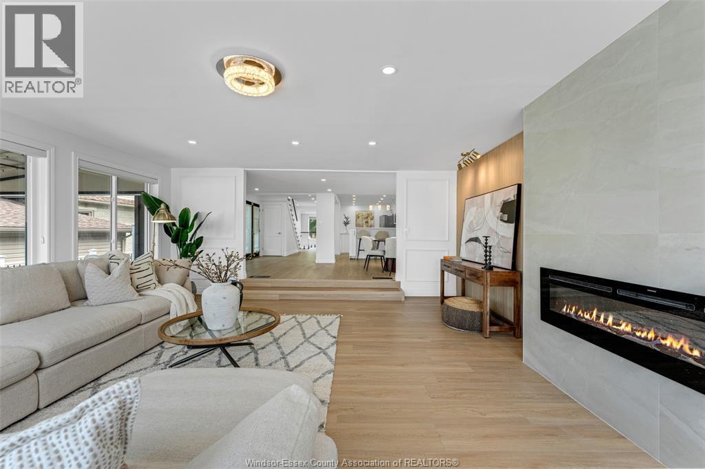 8830 Riverside Drive East, Windsor, ON - Indoor Photo Showing Living Room With Fireplace