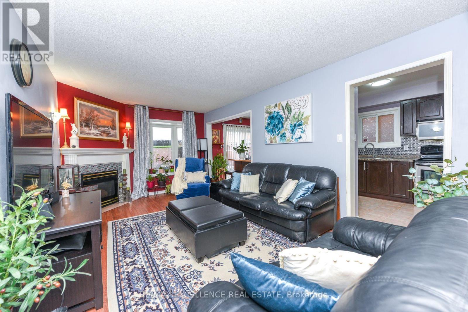 11 Arthurs Crescent, Brampton, ON - Indoor Photo Showing Living Room With Fireplace