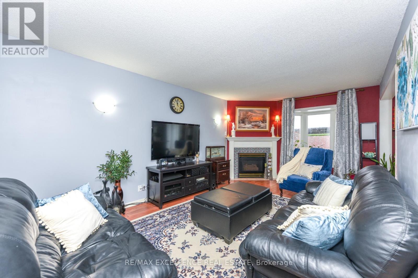 11 Arthurs Crescent, Brampton, ON - Indoor Photo Showing Living Room With Fireplace