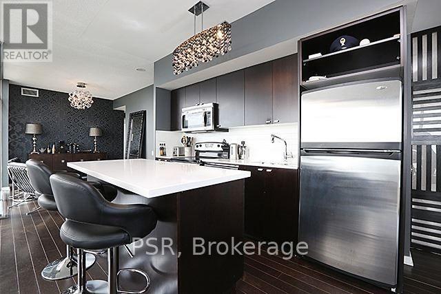 Huge Island/Breakfast Bar - 2104 - 103 The Queens Way, Toronto, ON - Indoor Photo Showing Kitchen