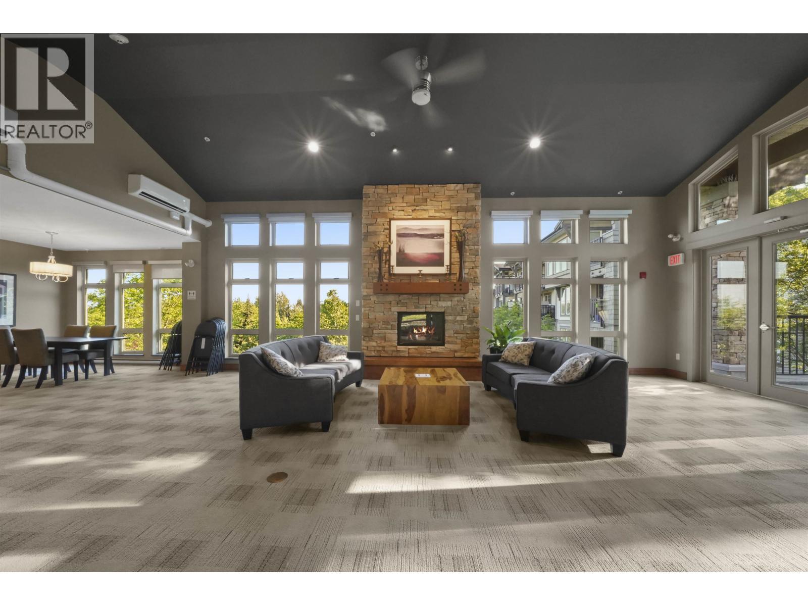 114 3178 Dayanee Springs Boulevard, Coquitlam, BC - Indoor Photo Showing Living Room With Fireplace