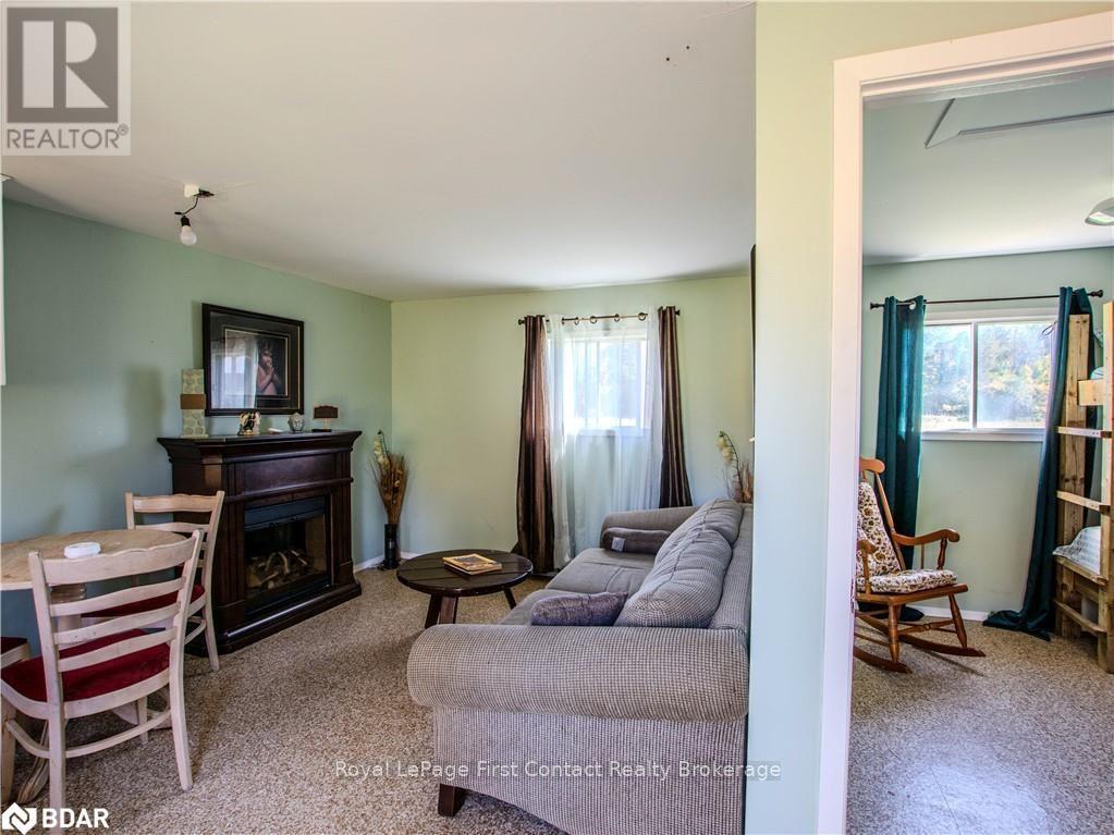 2041 Flos Rd Four Road W, Springwater, ON - Indoor With Fireplace