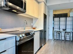 Slide-in flat glass cooktop, stone counters -