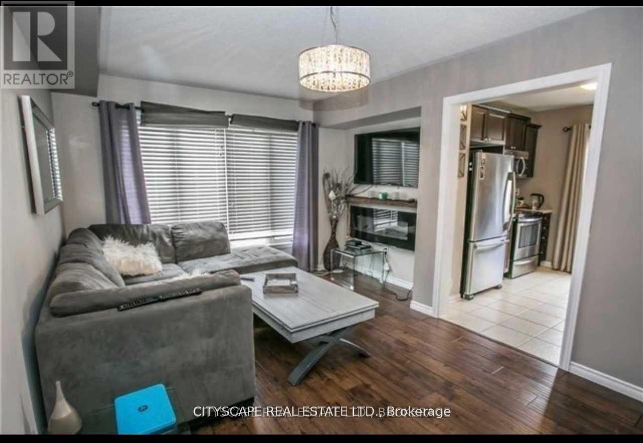 1023 Stemman Place, Milton, ON - Indoor Photo Showing Living Room With Fireplace