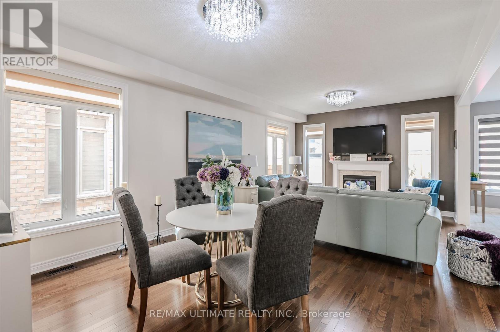 47 Lewis Avenue, Bradford West Gwillimbury, ON - Indoor Photo Showing Dining Room With Fireplace