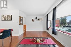 Expansive Living Room with Rich Hardwood Flooring -