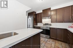 The Gourmet Kitchen Showcases Quartz Countertops -