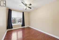 Second Bedroom w/Ceiling Fan and Hardwood Flooring -