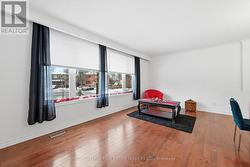 Expansive Living Room with Rich Hardwood Flooring -