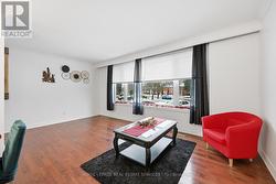 Expansive Living Room with Rich Hardwood Flooring -