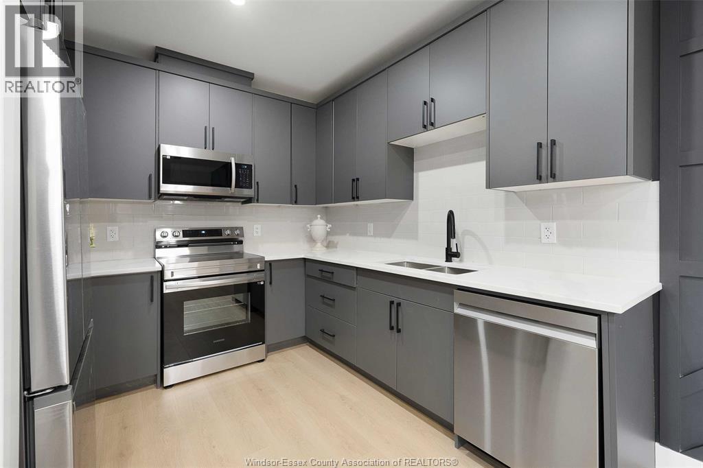 705 Grand Marais Unit# 301, Windsor, ON - Indoor Photo Showing Kitchen With Double Sink