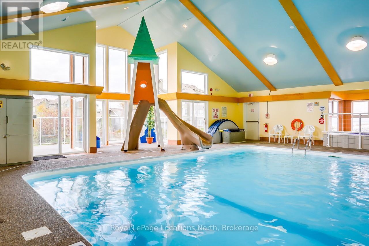 Rec facilities included in monthly condo fee - 465 Mariners Way, Collingwood, ON - Indoor Photo Showing Other Room With In Ground Pool