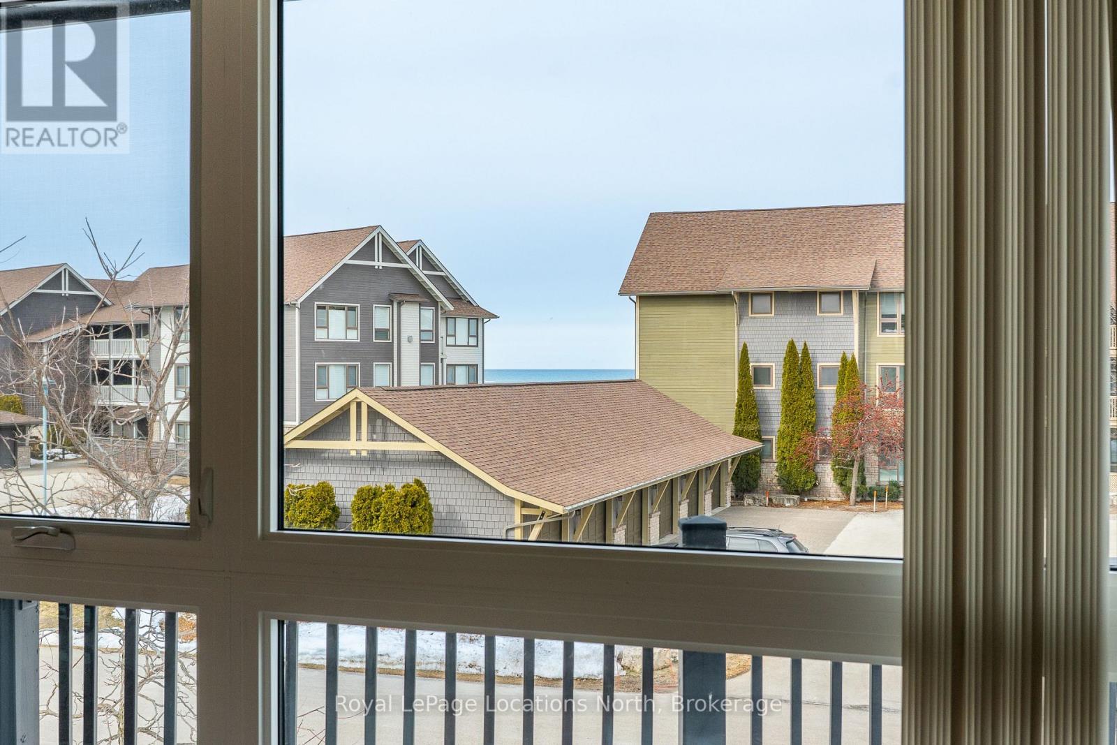 Partial water views from Balcony - 465 Mariners Way, Collingwood, ON - Indoor Photo Showing Other Room