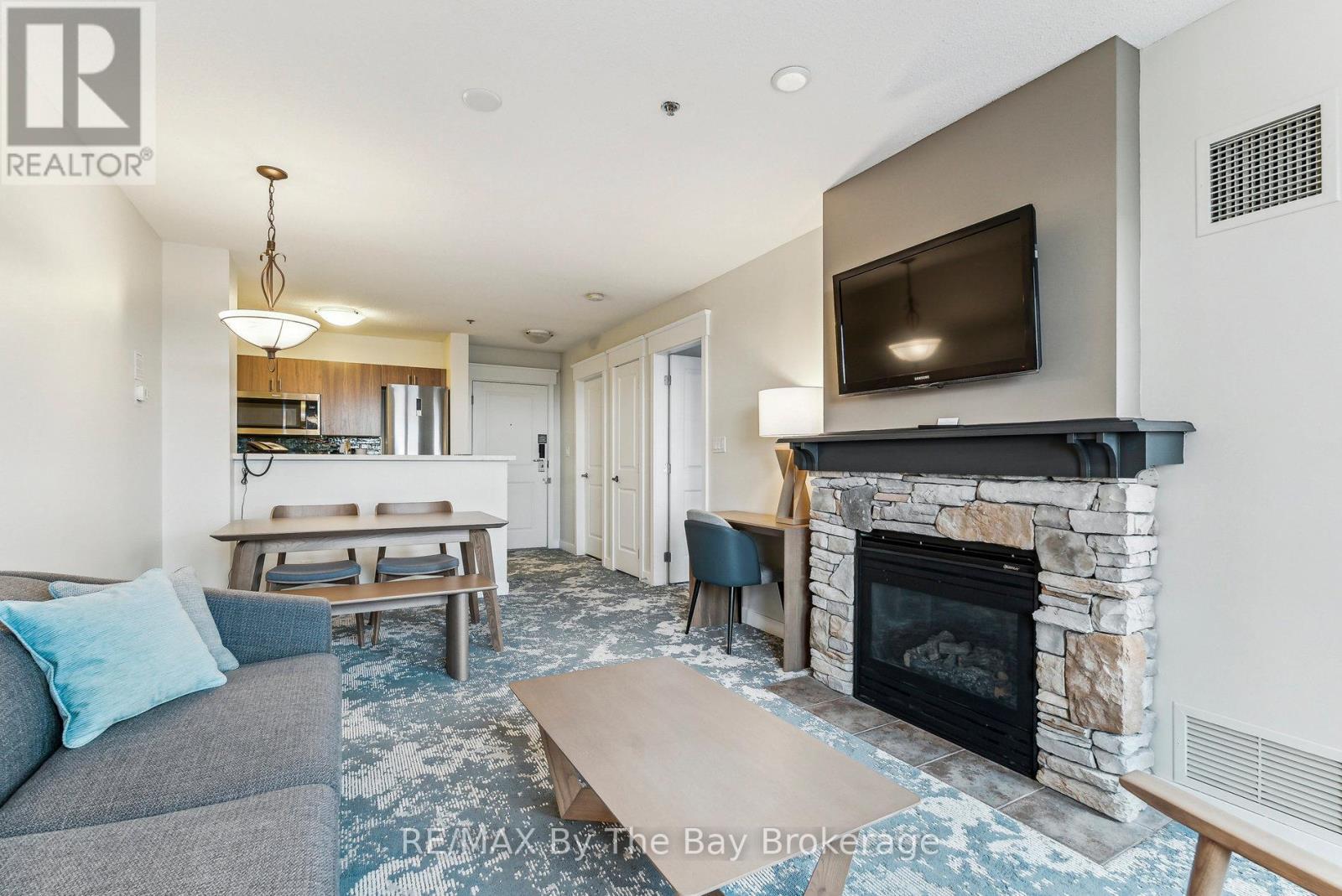 317 - 170 Jozo Weider Boulevard, Blue Mountains, ON - Indoor Photo Showing Living Room With Fireplace