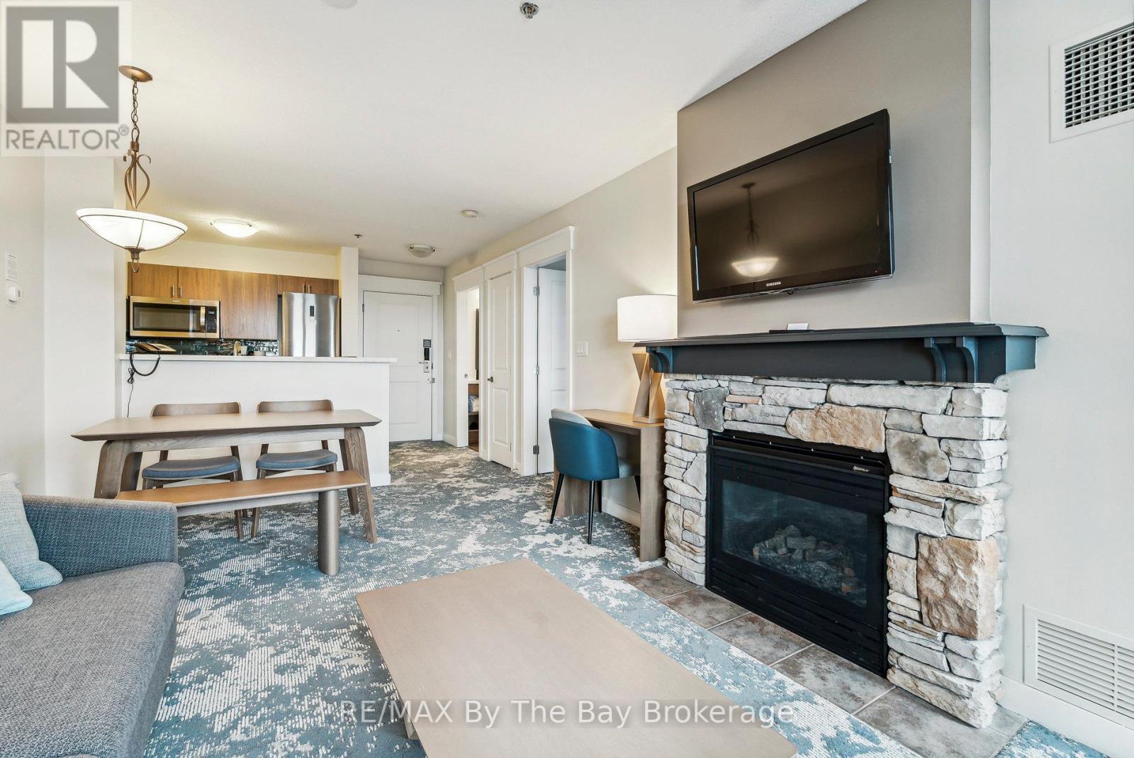 317 - 170 Jozo Weider Boulevard, Blue Mountains, ON - Indoor Photo Showing Living Room With Fireplace