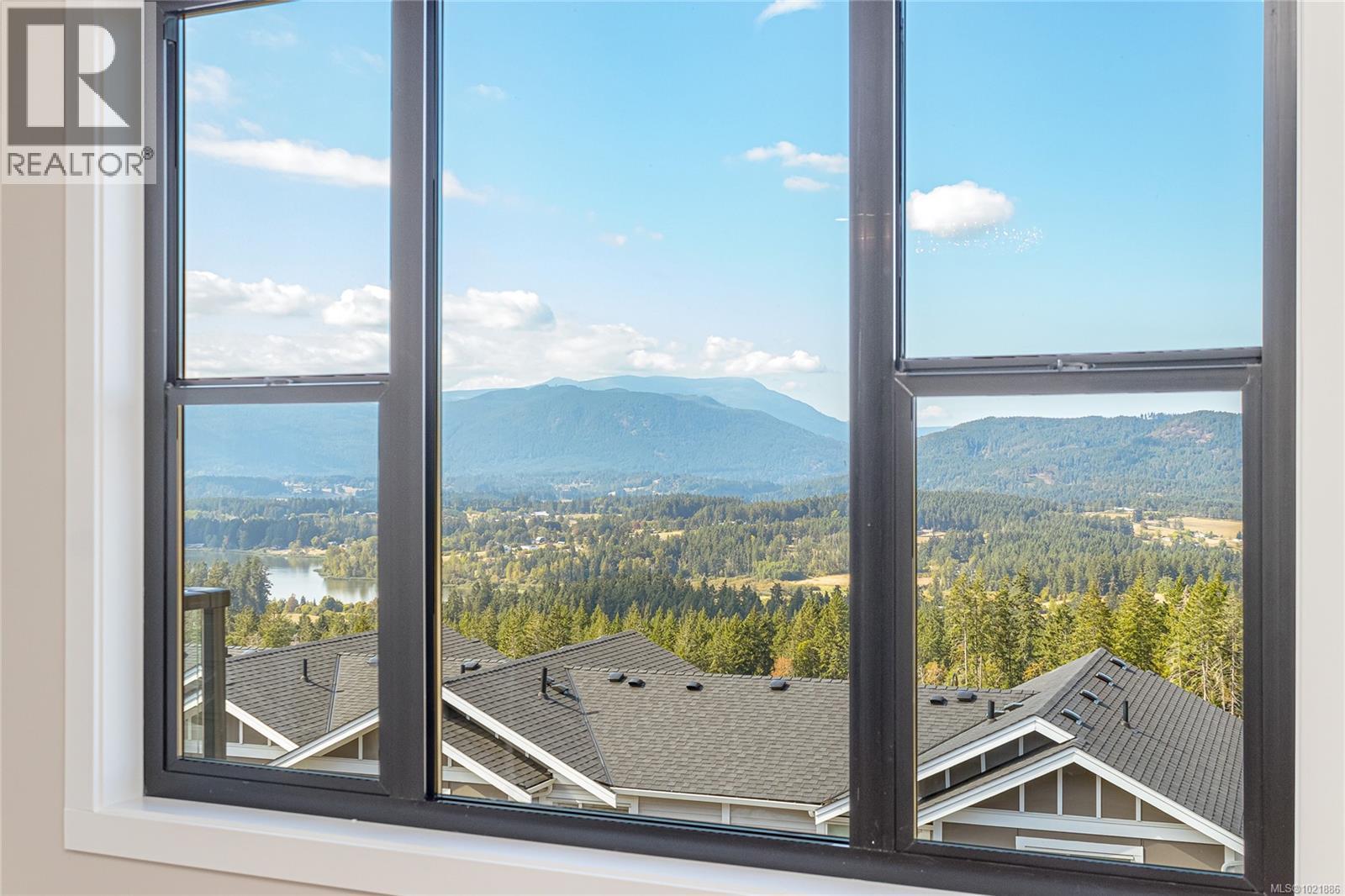 Mountain view with a forest - 3195 Woodrush Dr, Duncan, BC - Indoor Photo Showing Other Room