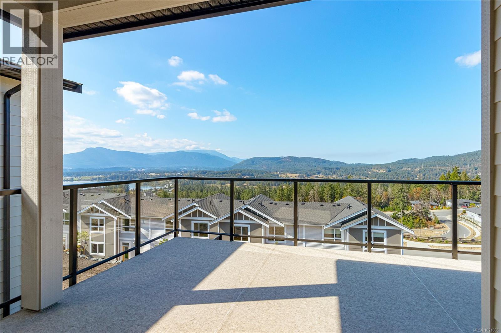 View of patio with a mountain view - 3195 Woodrush Dr, Duncan, BC - Outdoor With Balcony With View