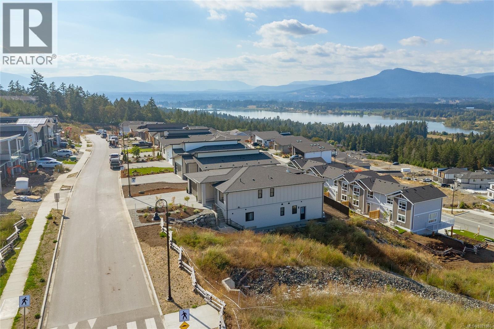 Aerial view of residential area featuring a water and mountain view - 3195 Woodrush Dr, Duncan, BC - Outdoor With View