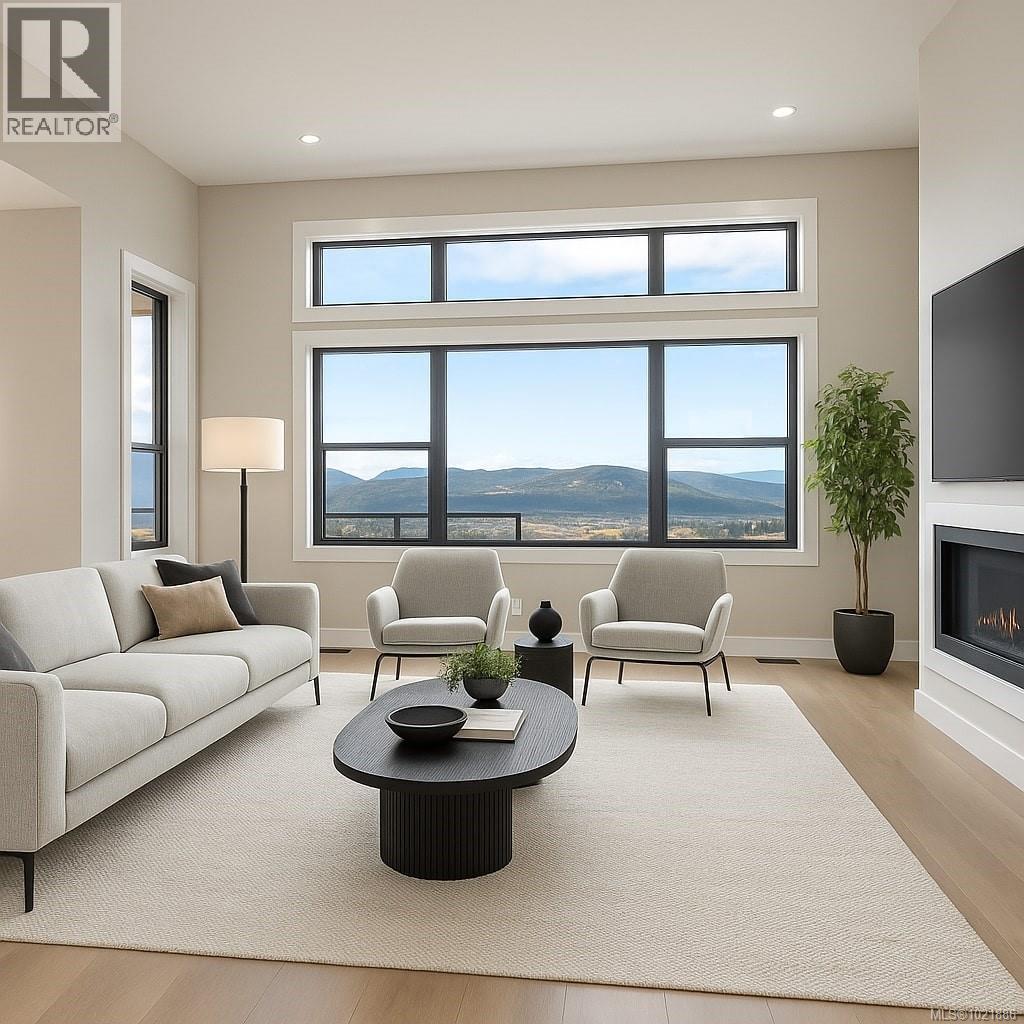 Living area V.S. - 3195 Woodrush Dr, Duncan, BC - Indoor Photo Showing Living Room With Fireplace