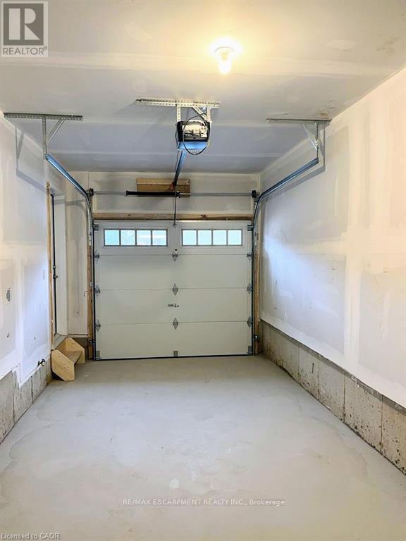 45 - 305 Garner Road W, Hamilton, ON - Indoor Photo Showing Garage