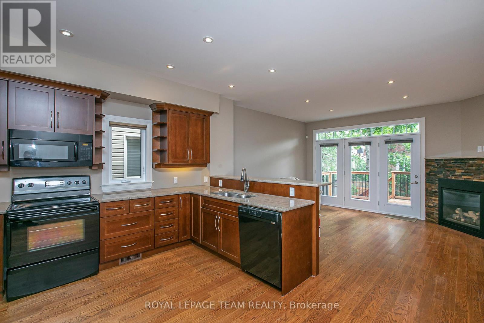 691 Edison Avenue, Ottawa, ON - Indoor Photo Showing Kitchen With Fireplace With Double Sink