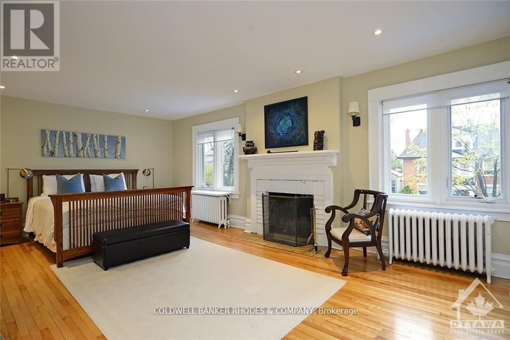 62 Powell Avenue, Ottawa, ON - Indoor Photo Showing Bedroom With Fireplace