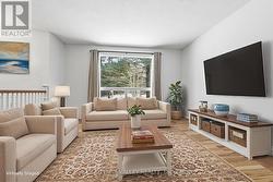 Virtually staged living room on main floor -