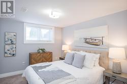 extra guest bedroom with large window and closet -