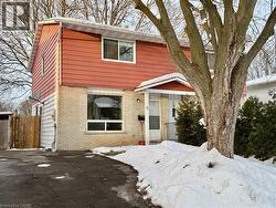 Colonial house featuring brick siding -