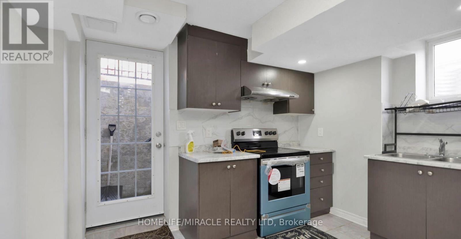 Basement - 77 Owlridge Drive, Brampton, ON - Indoor Photo Showing Kitchen With Double Sink