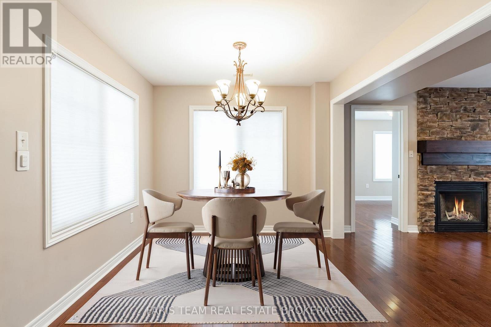 Virtually Staged - 44 Marina Village Drive, Georgian Bay, ON - Indoor Photo Showing Dining Room With Fireplace