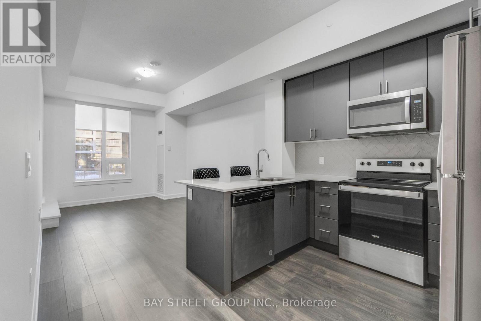 204 - 3200 William Coltson Avenue, Oakville, ON - Indoor Photo Showing Kitchen With Stainless Steel Kitchen