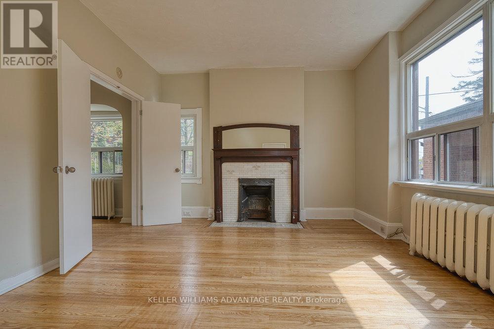 24 Indian Road Crescent, Toronto, ON - Indoor Photo Showing Living Room With Fireplace