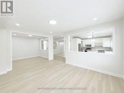 Family Room looking at Living Room and Kitchen -