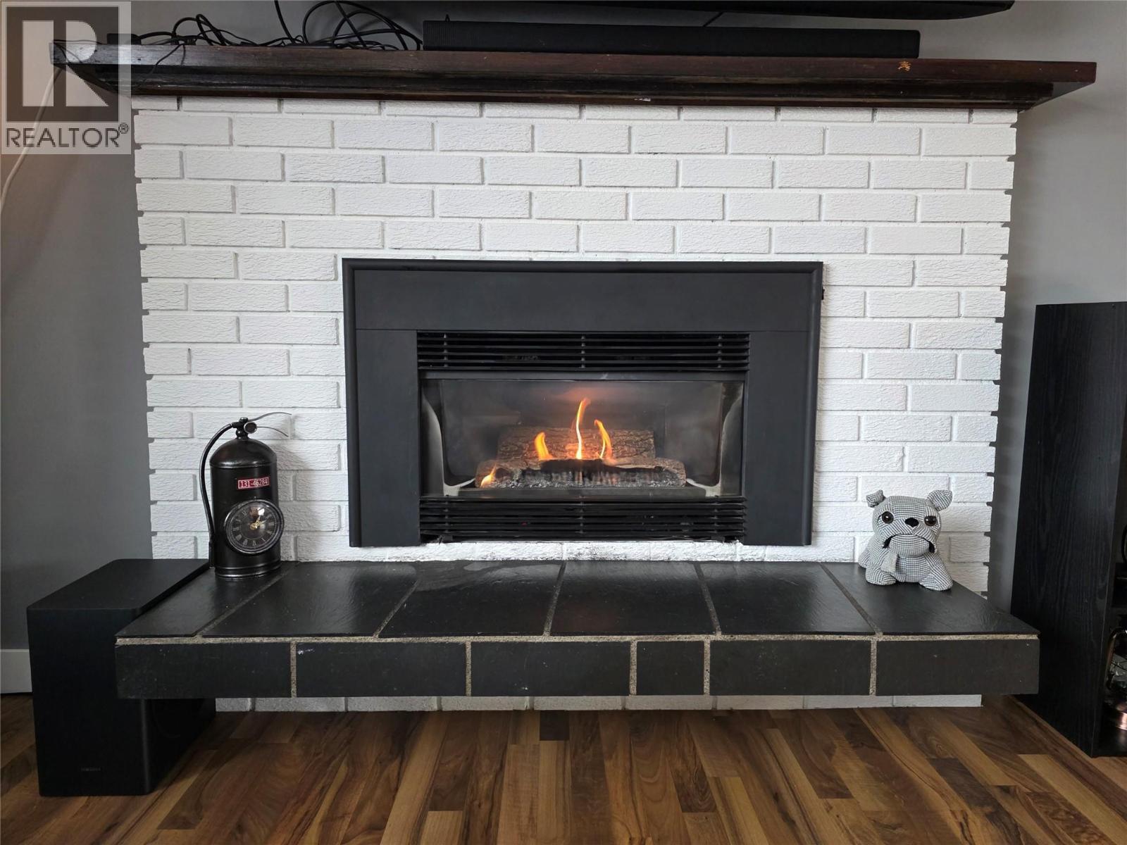 176 Cambourne Crescent, Elkford, BC - Indoor Photo Showing Living Room With Fireplace
