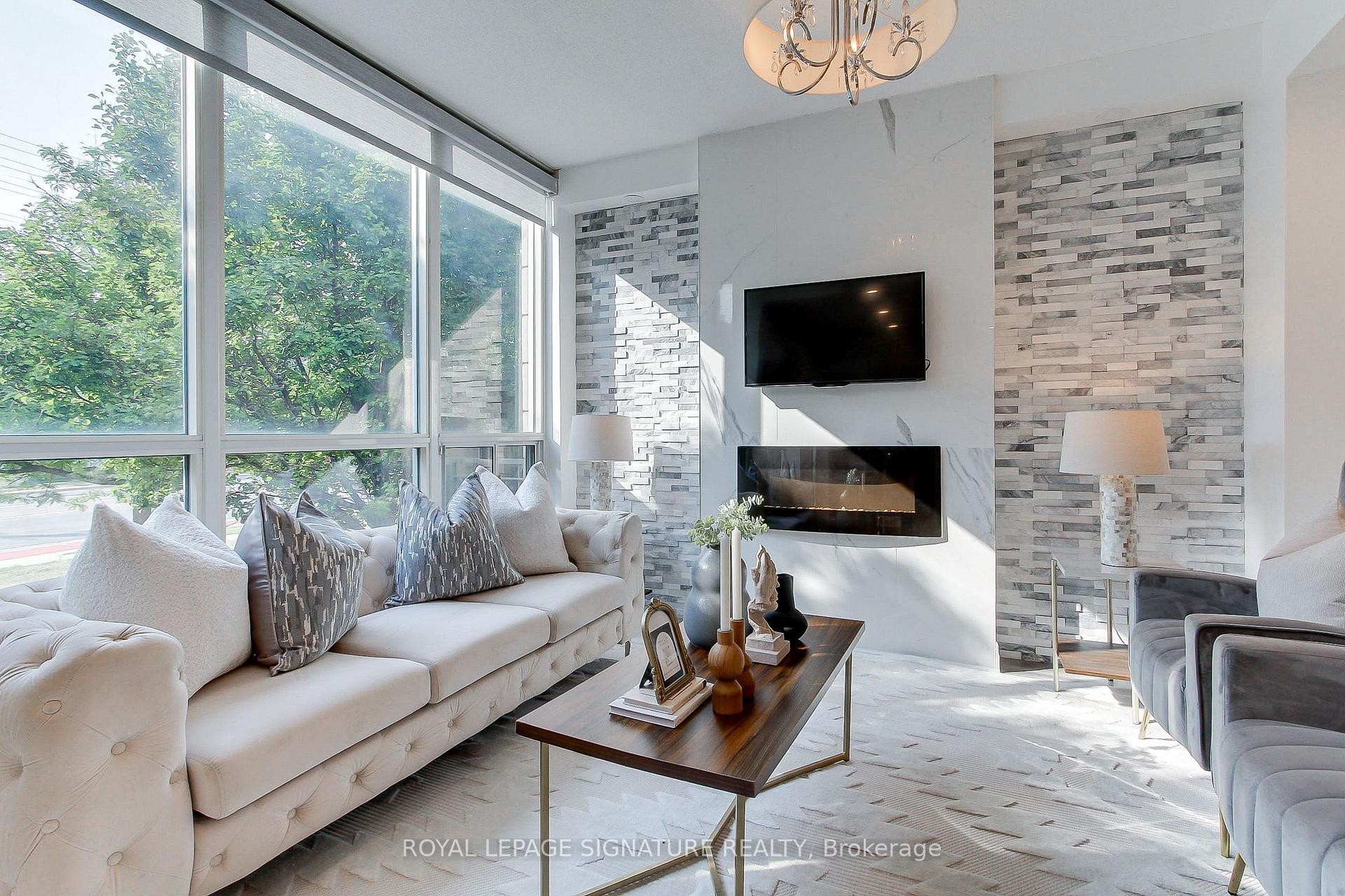 Th-104-90 Absolute Avenue, Mississauga, ON - Indoor Photo Showing Living Room With Fireplace