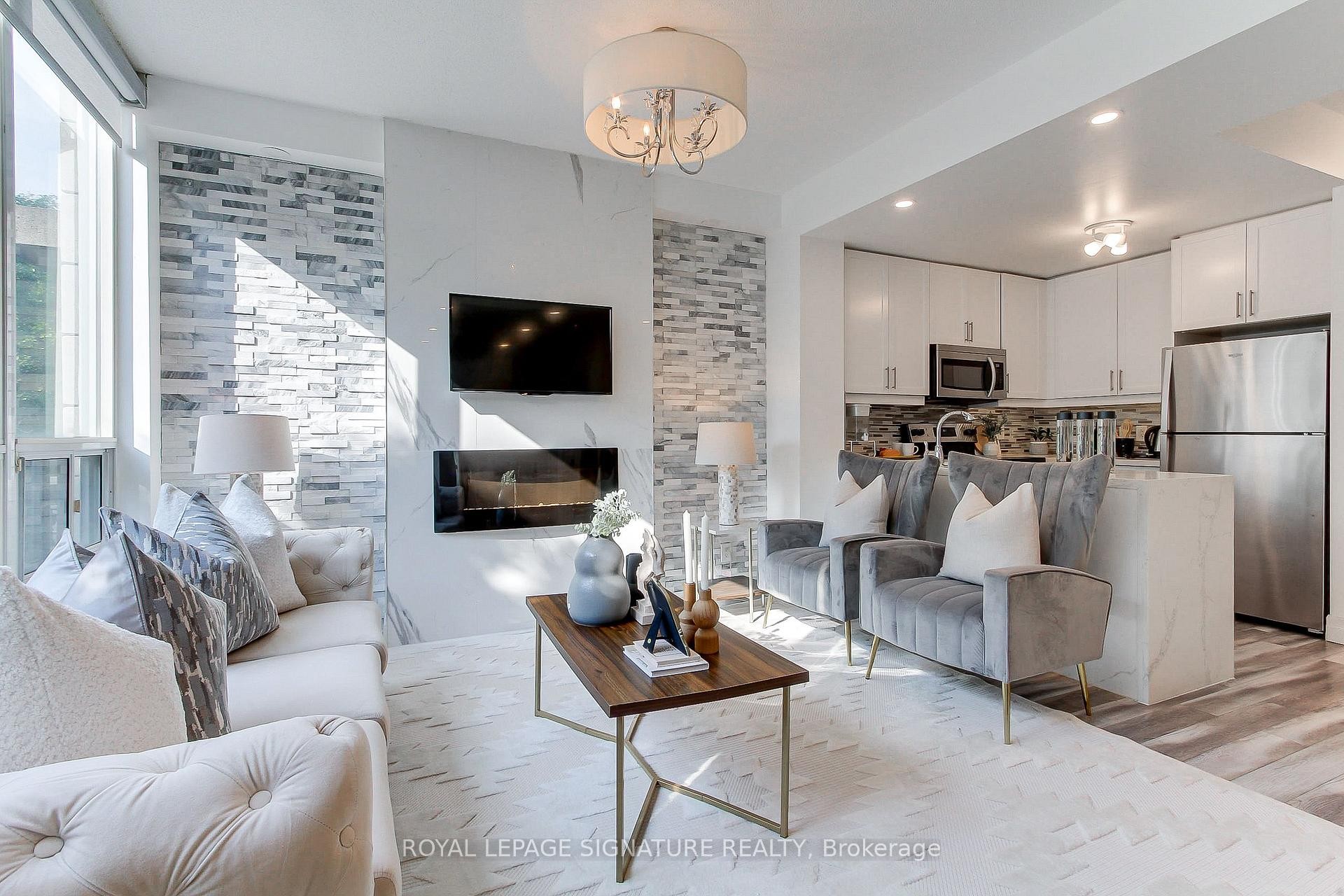 Th-104-90 Absolute Avenue, Mississauga, ON - Indoor Photo Showing Living Room With Fireplace