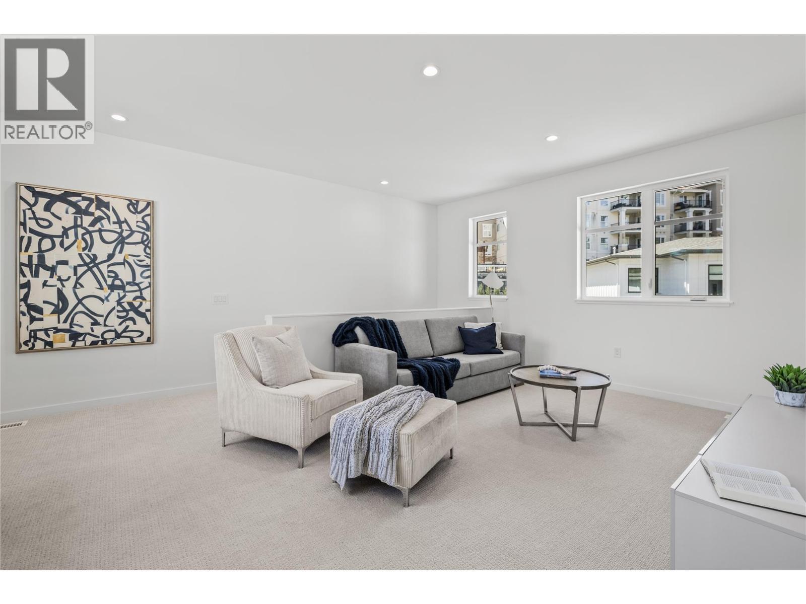 Flex space - Photo of a similar home in the community. - 1979 Country Club Drive Unit# 7, Kelowna, BC - Indoor