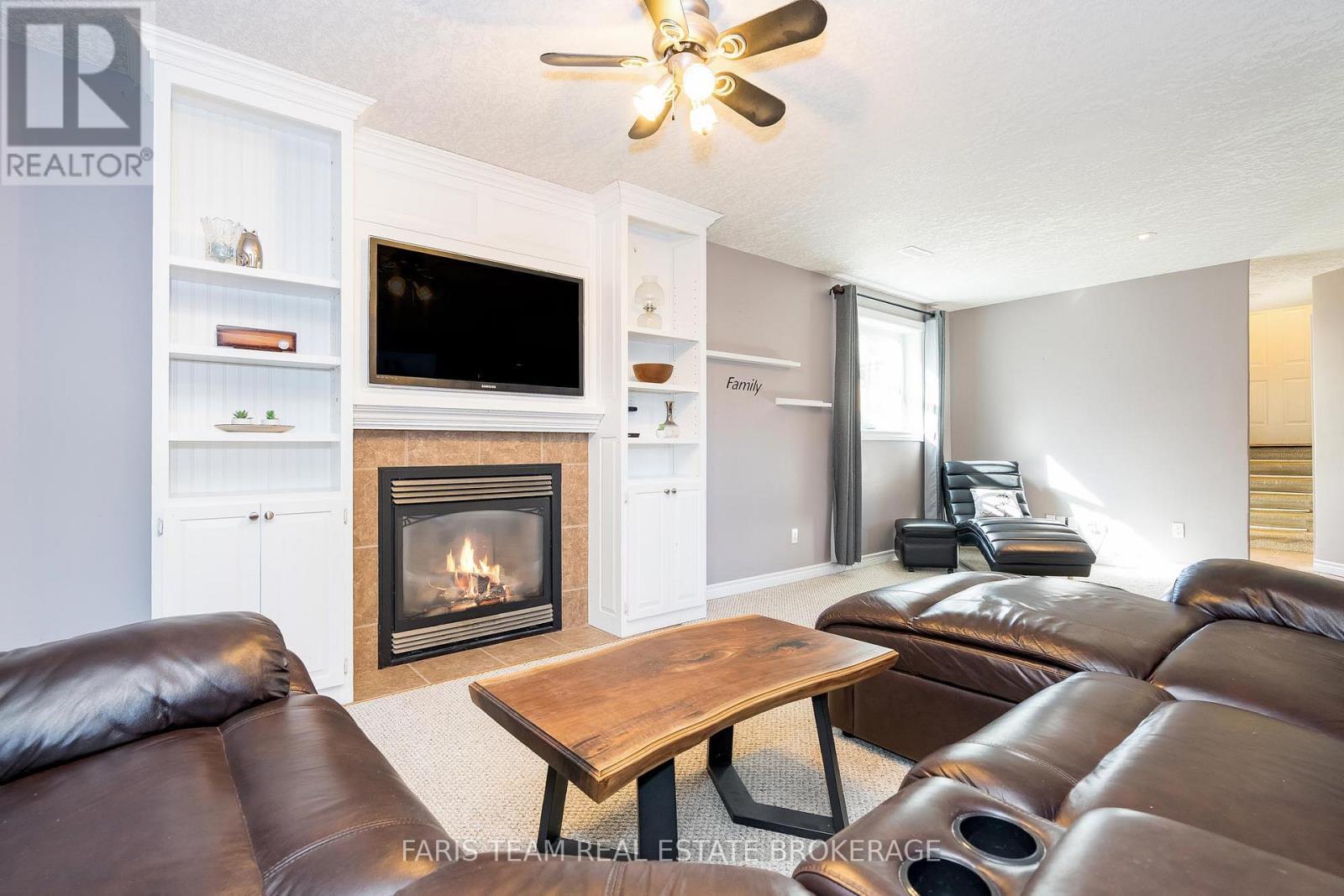 24 Parr Boulevard, Springwater, ON - Indoor Photo Showing Living Room With Fireplace