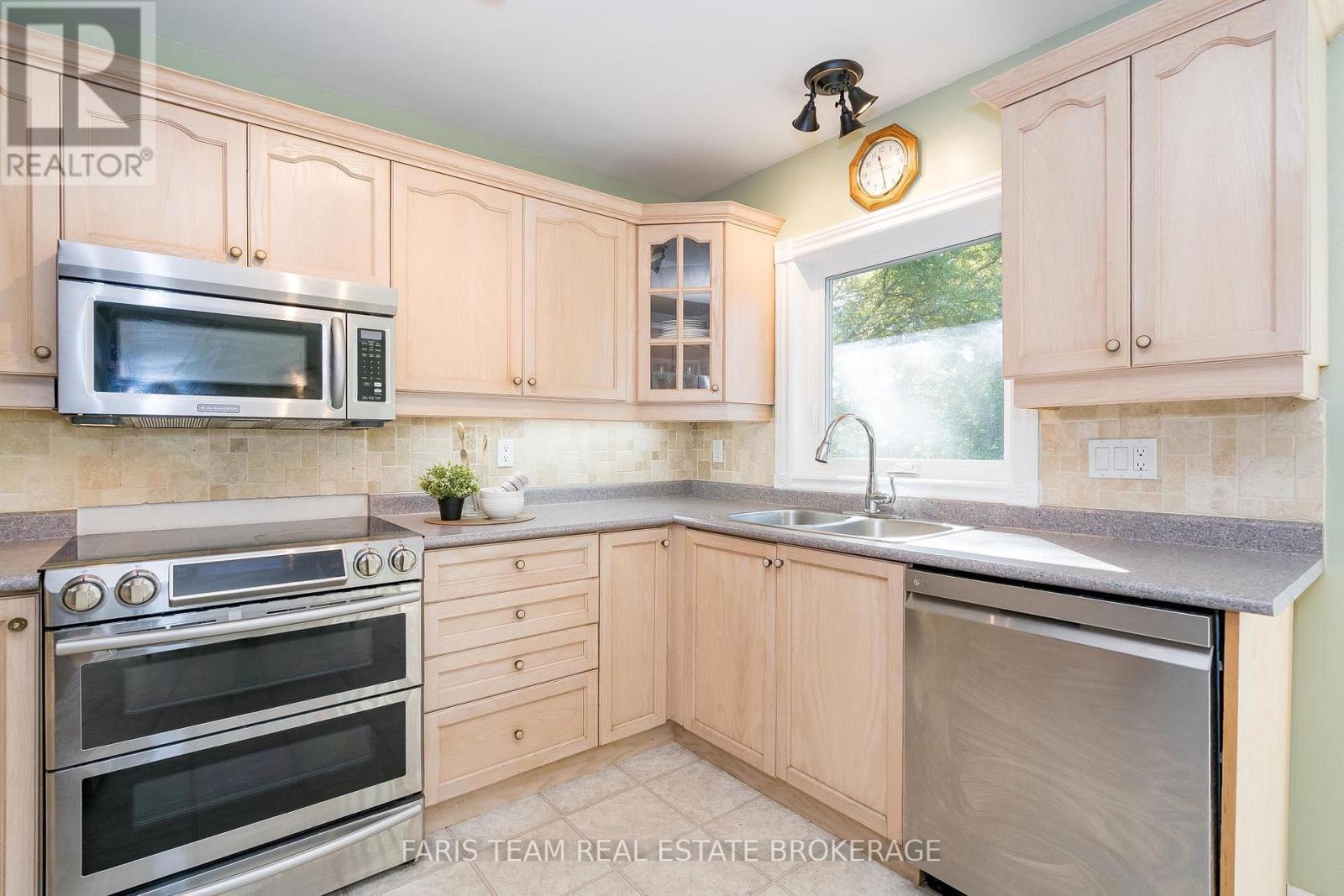 24 Parr Boulevard, Springwater, ON - Indoor Photo Showing Kitchen With Double Sink