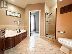 Upstairs 4pc w/ jacuzzi & shower -