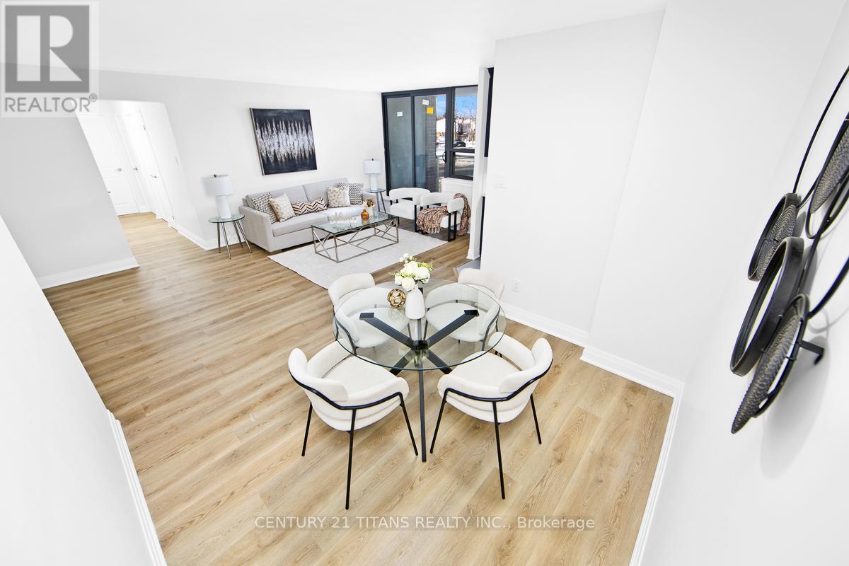 201 - 100 Wingarden Court, Toronto, ON - Indoor Photo Showing Living Room