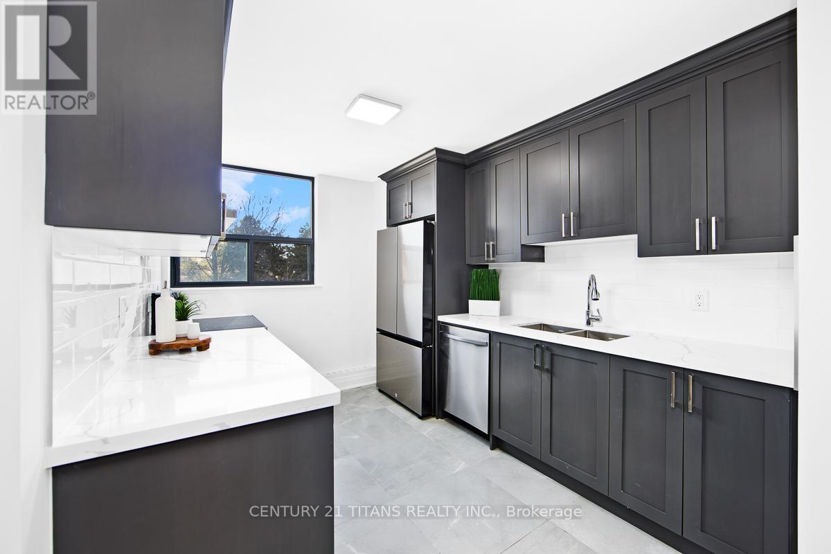201 - 100 Wingarden Court, Toronto, ON - Indoor Photo Showing Kitchen With Double Sink