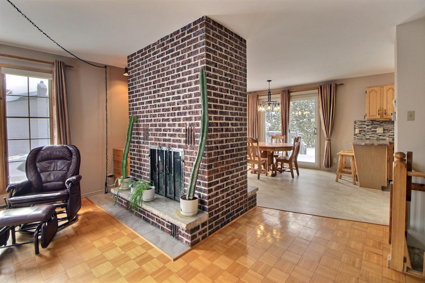 Living room - 101 Rue Rompré, Amos, QC - Indoor With Fireplace