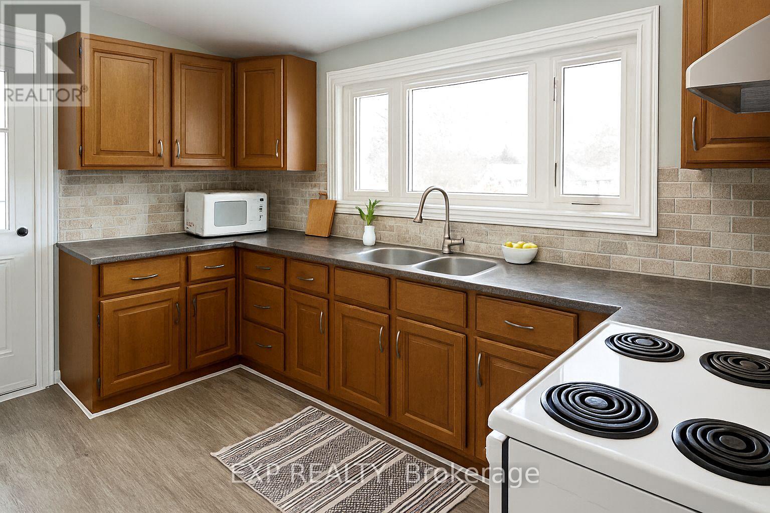 VIRTUALLY DECLUTTERED KITCHEN - 47 Augusta Street, South Dundas, ON - Indoor Photo Showing Kitchen With Double Sink