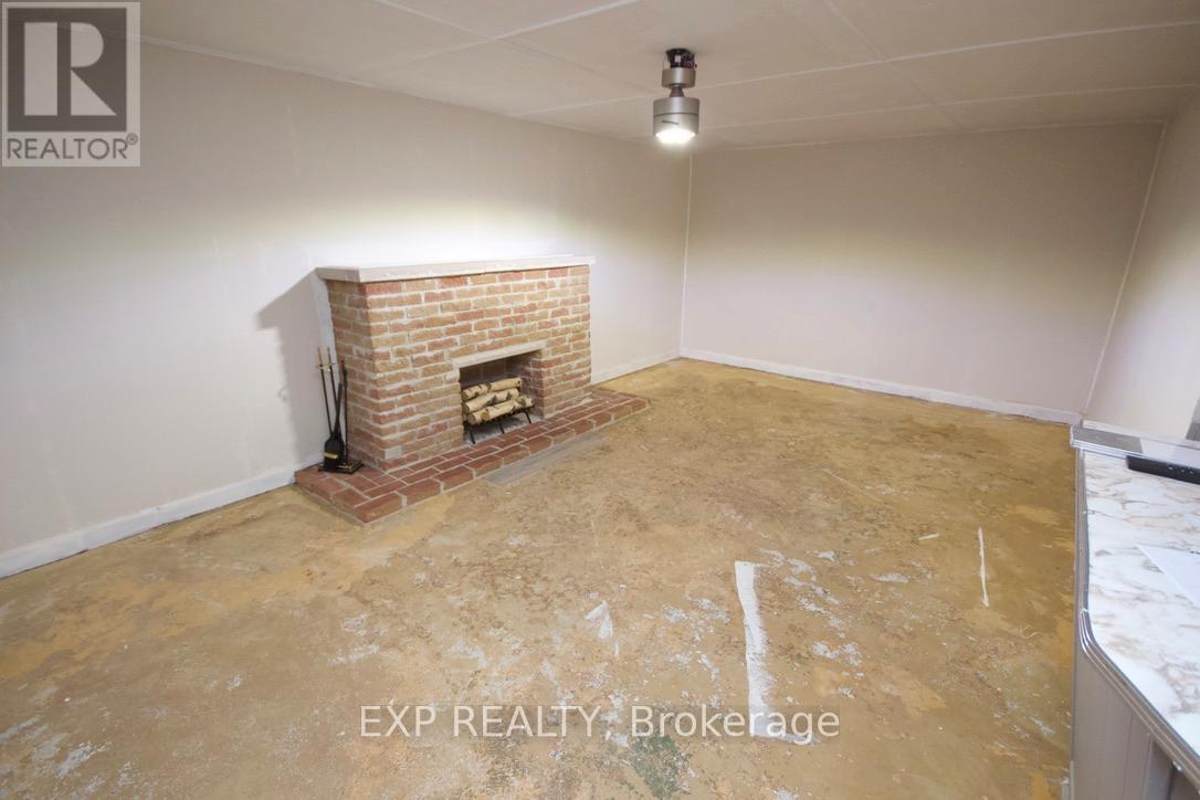 BASEMENT REC ROOM, WITH BAR ARA - 47 Augusta Street, South Dundas, ON - Indoor Photo Showing Other Room With Fireplace