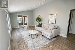 VIRTUALLY STAGED MAIN FLOOR LIVING ROOM -