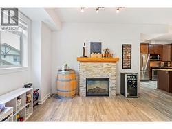 Bright living room with electric fireplace and new laminate floors -