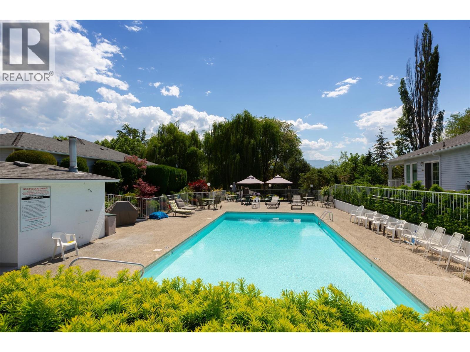 1101 Cameron Avenue Unit# 60, Kelowna, BC - Outdoor With In Ground Pool With Backyard